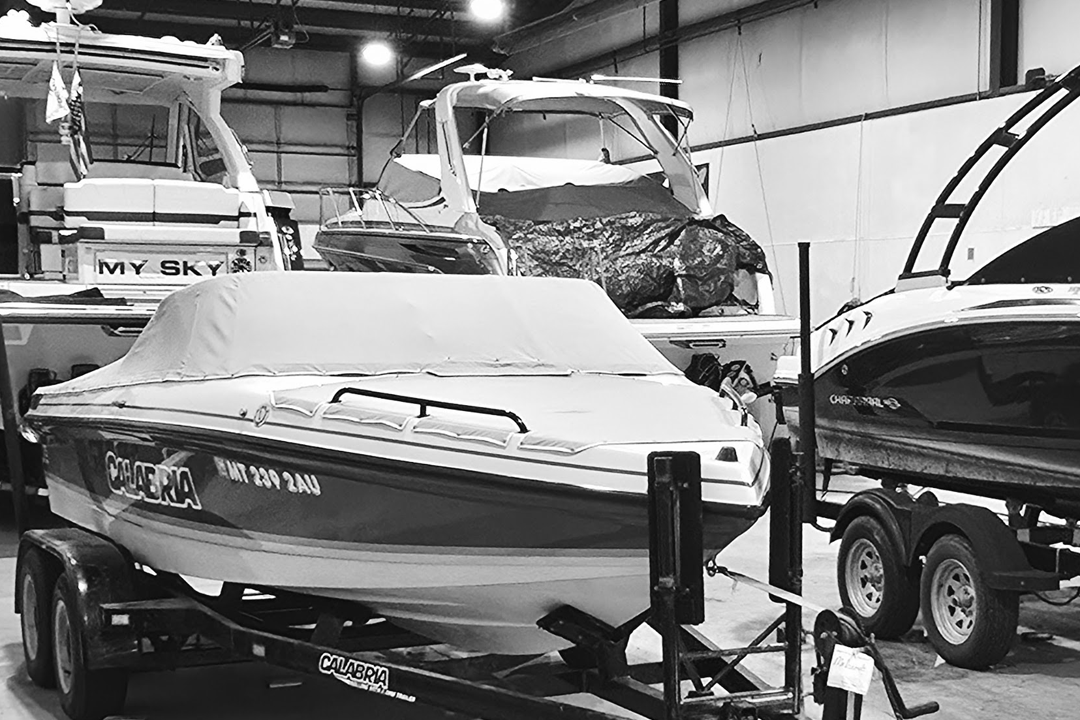 Boats in a workshop undergoing maintenance and repairs.